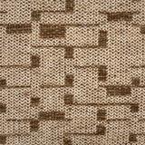 Close-up of a textured rug with a brown and beige pattern