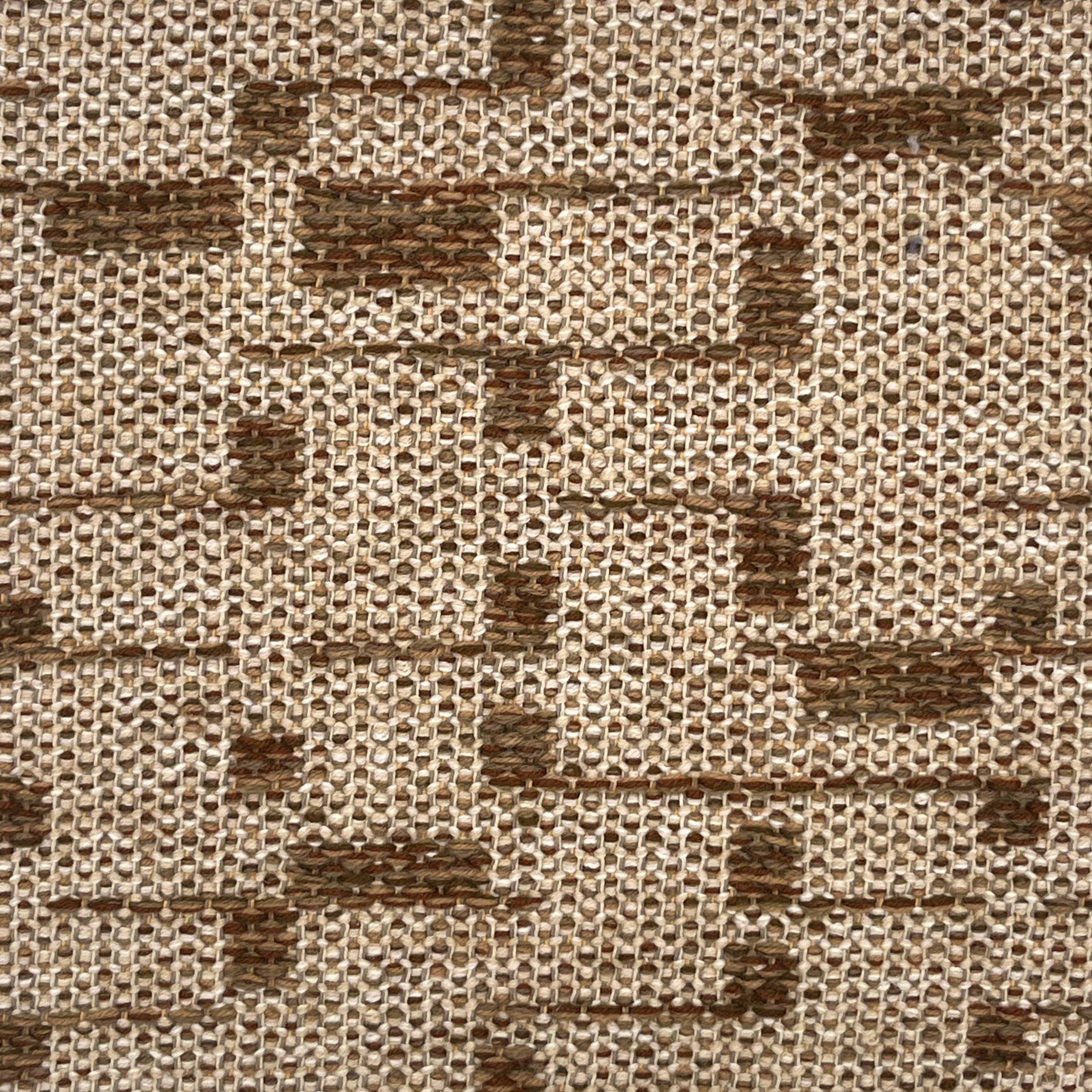 Close-up of a textured rug with a brown and beige pattern