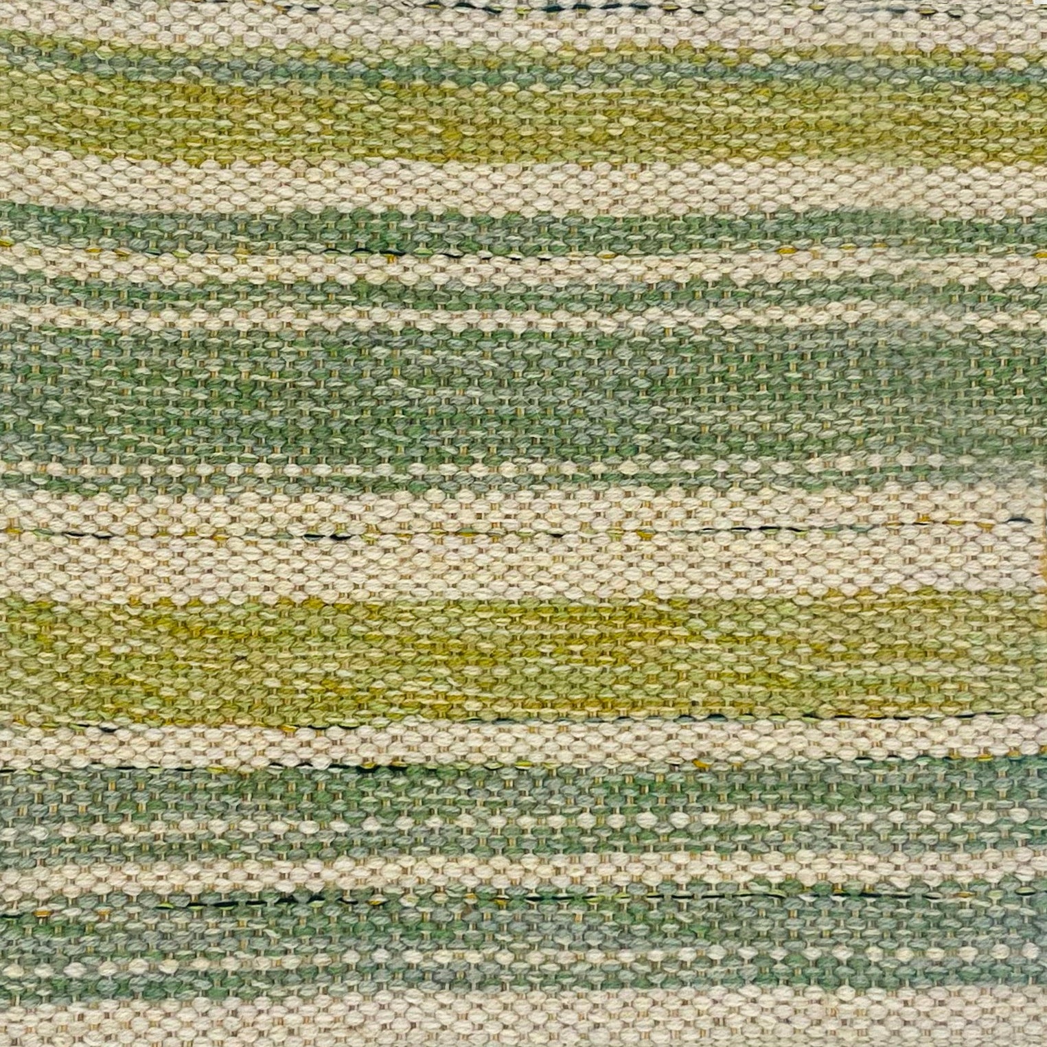 Woven rug swatch in natural fibers in apple green, ecru and sage green mixed width stripe pattern