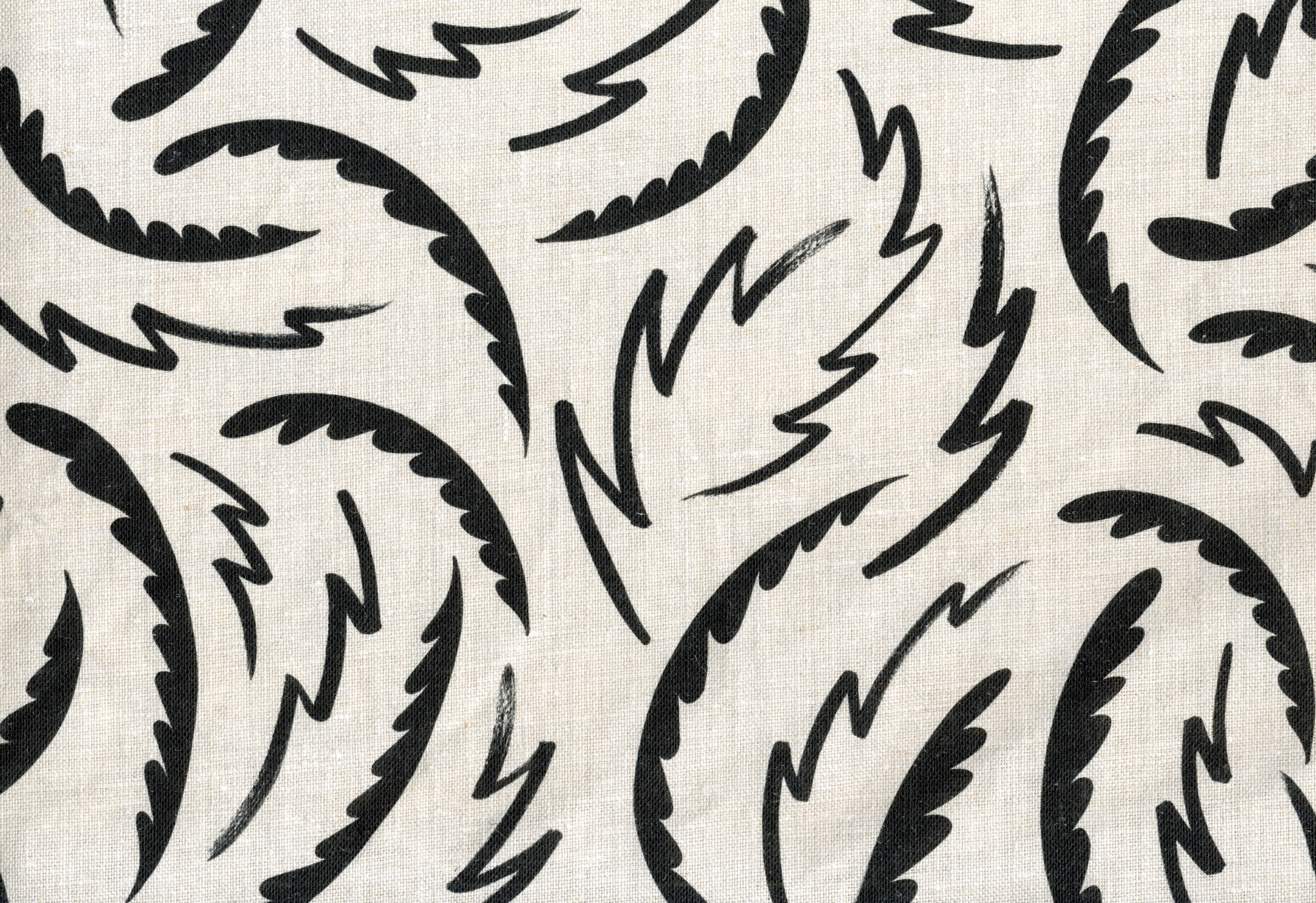 Linen fabric with a playful brushstroke print in black on a natural field.