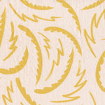 Linen fabric with a playful brushstroke print in yellow on a pale pink field.