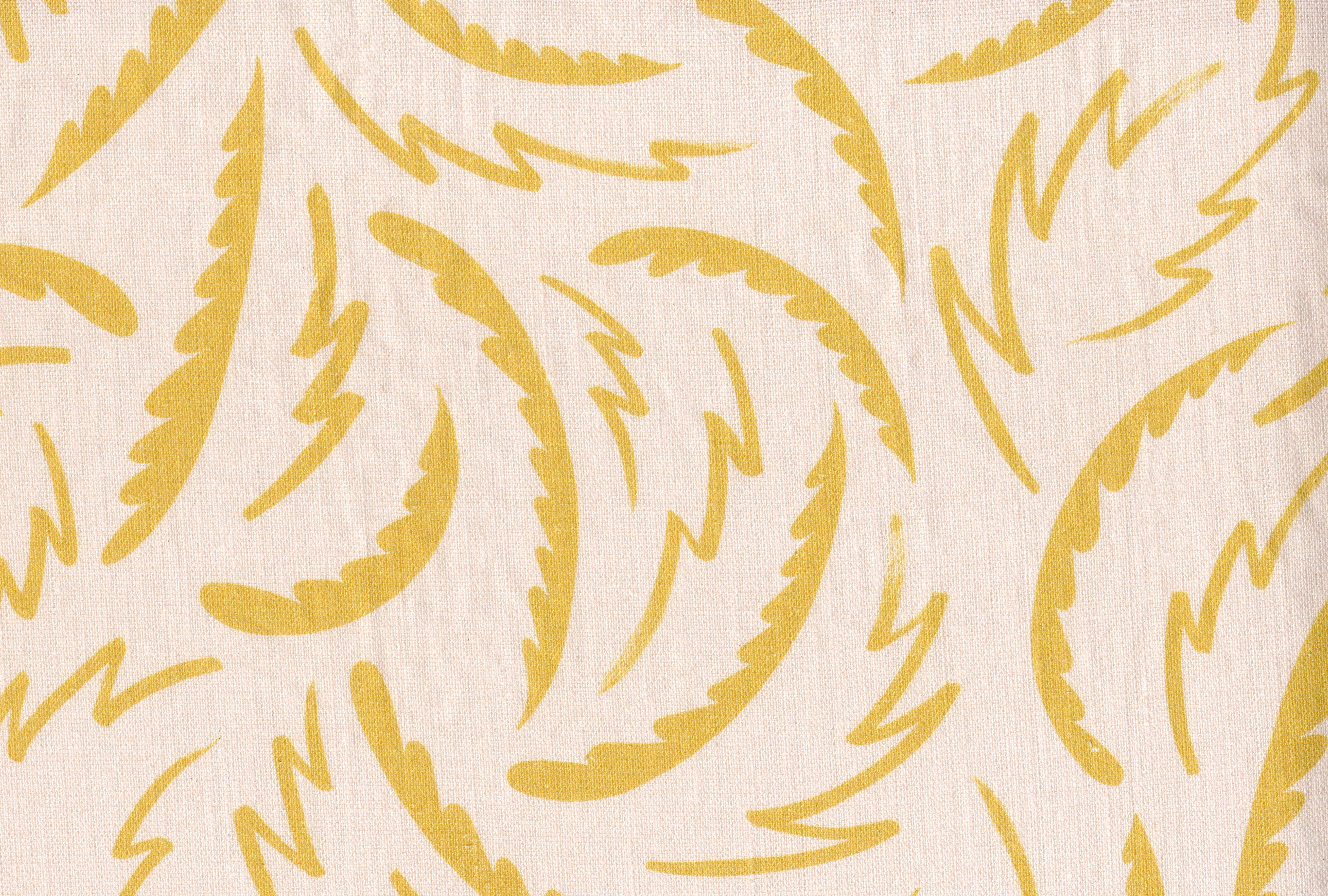 Linen fabric with a playful brushstroke print in yellow on a pale pink field.