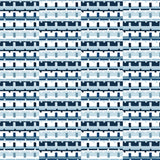 Detail of wallpaper in a playful geometric grid print in shades of blue, navy and white.