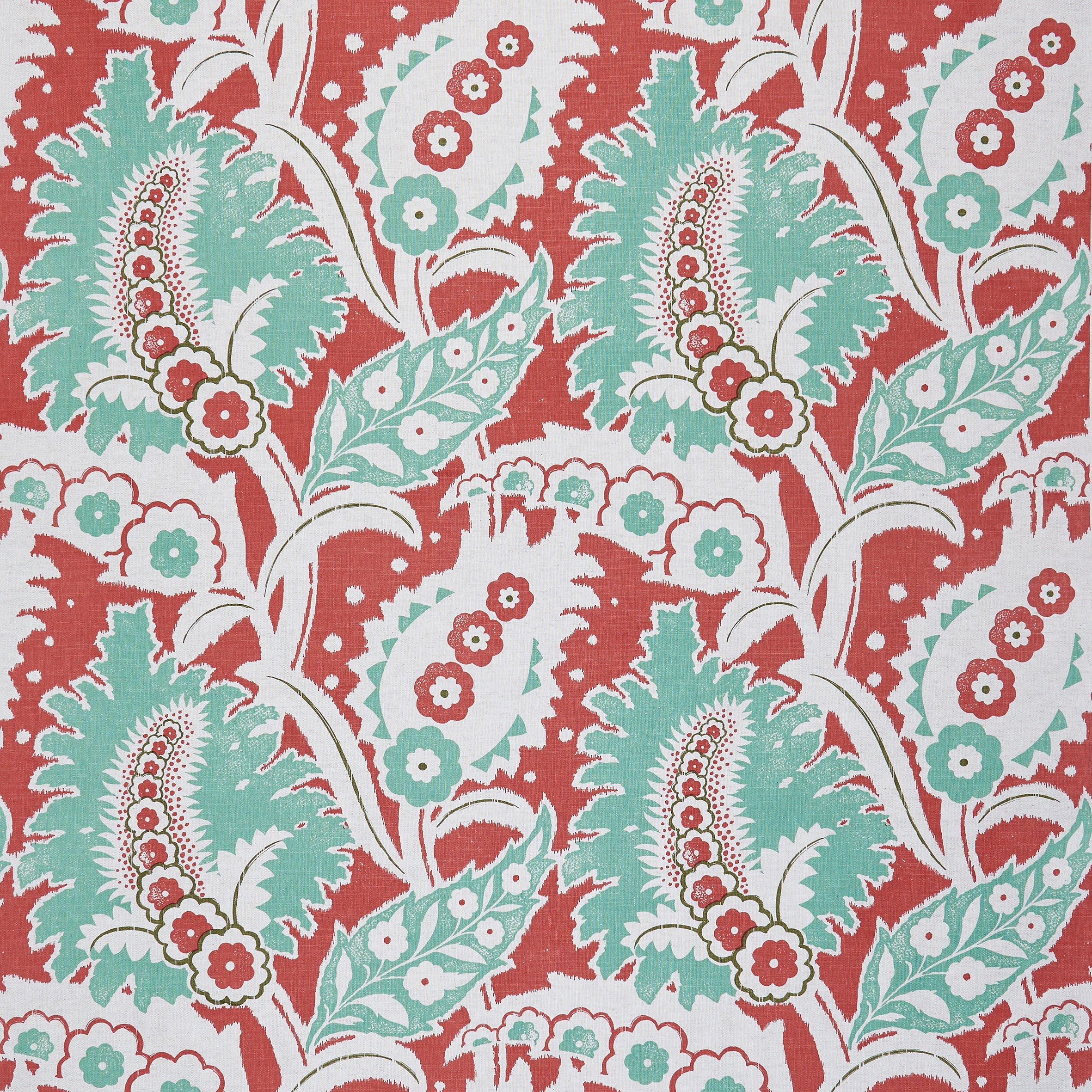 Detail of fabric in a botanical paisley print in shades of white, turquoise and green on a red field.