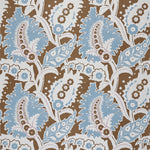 Detail of fabric in a botanical paisley print in shades of white, blue and purple on a brown field.