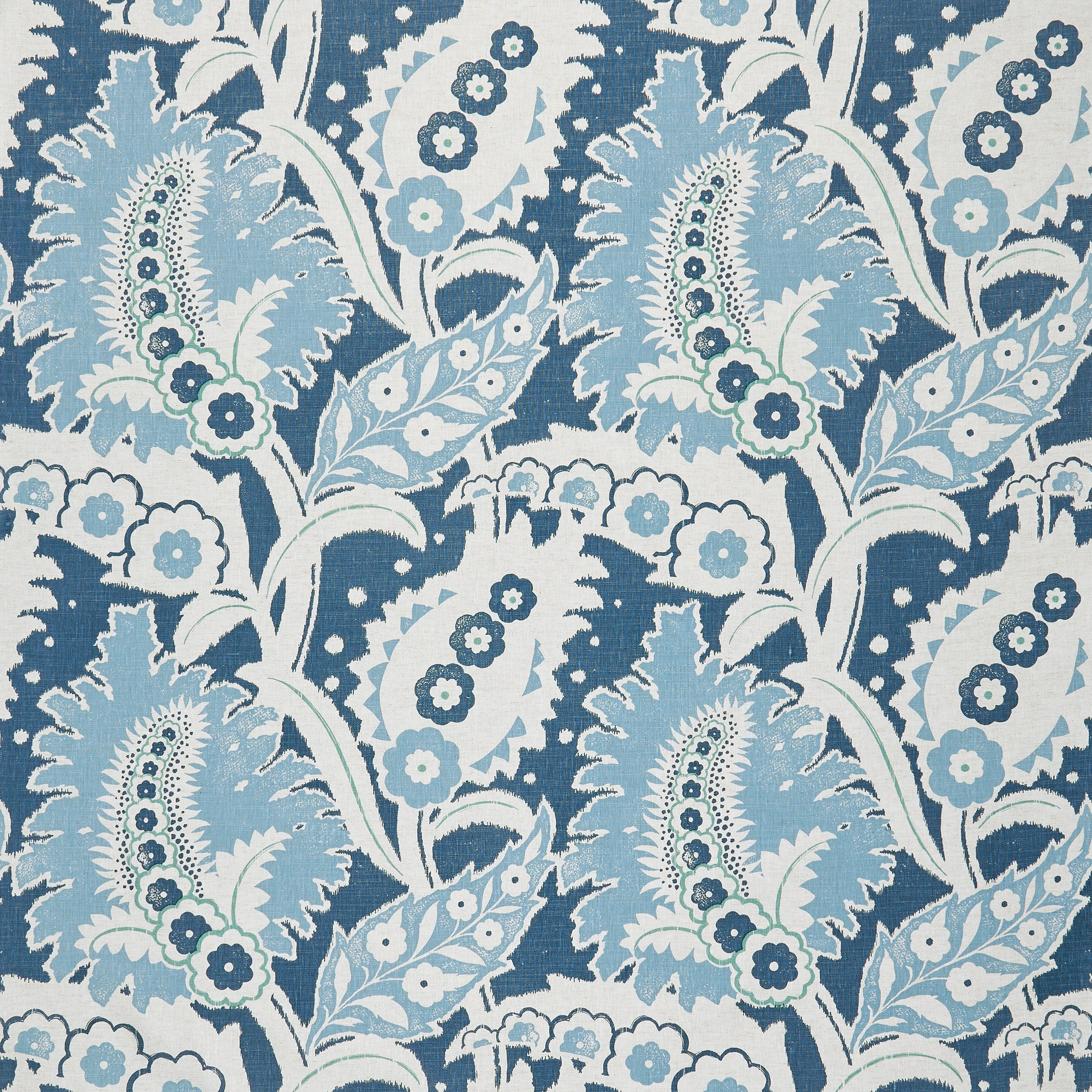 Detail of fabric in a botanical paisley print in shades of white, blue and green on a navy field.