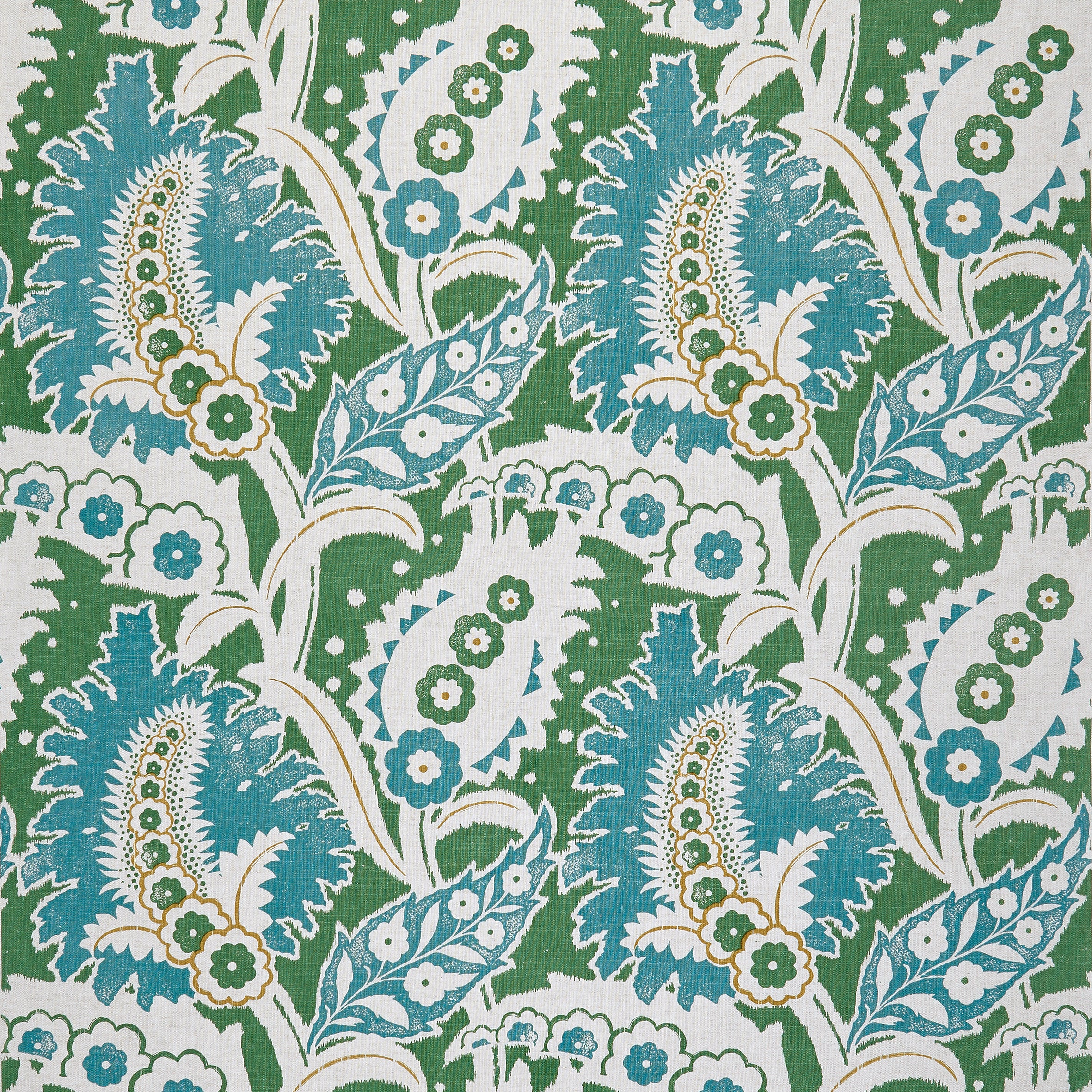 Detail of fabric in a botanical paisley print in shades of blue, white and brown on a green field.