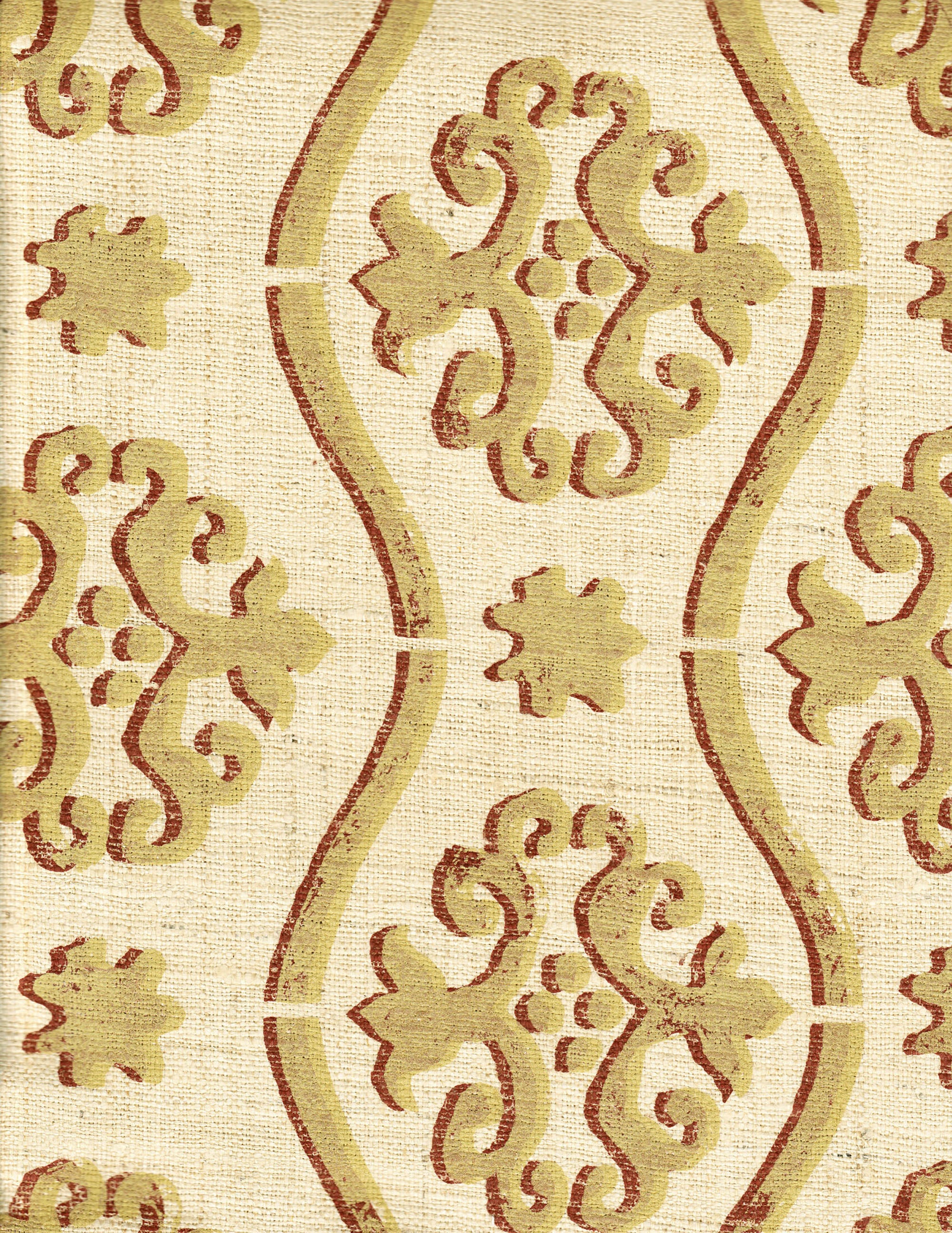 Detail of fabric in a damask stripe print in tan and dark red on a cream field.