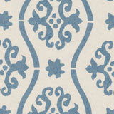 Detail of wallpaper in a damask stripe print in blue on a cream field.