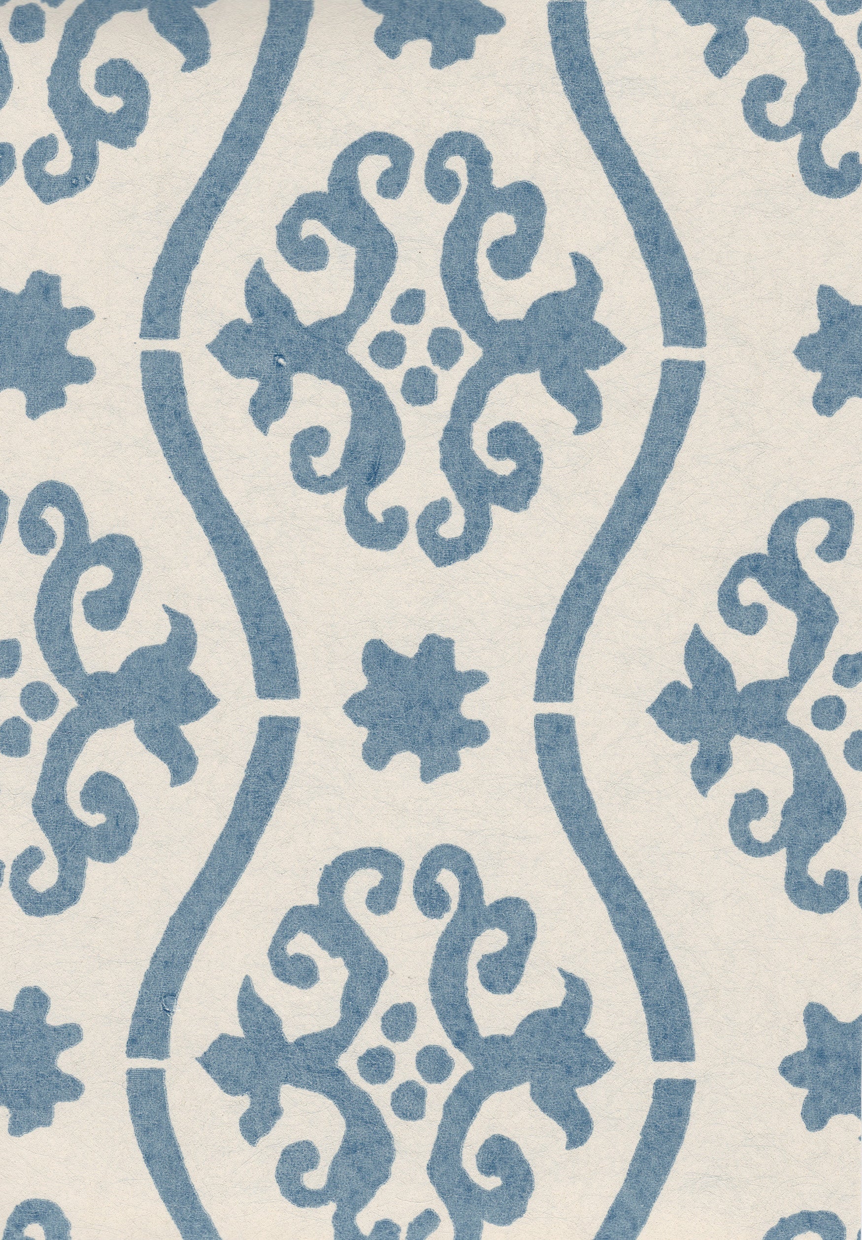 Detail of wallpaper in a damask stripe print in blue on a cream field.