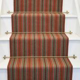 Striped flatweave runner in red grey and pink on white staircase