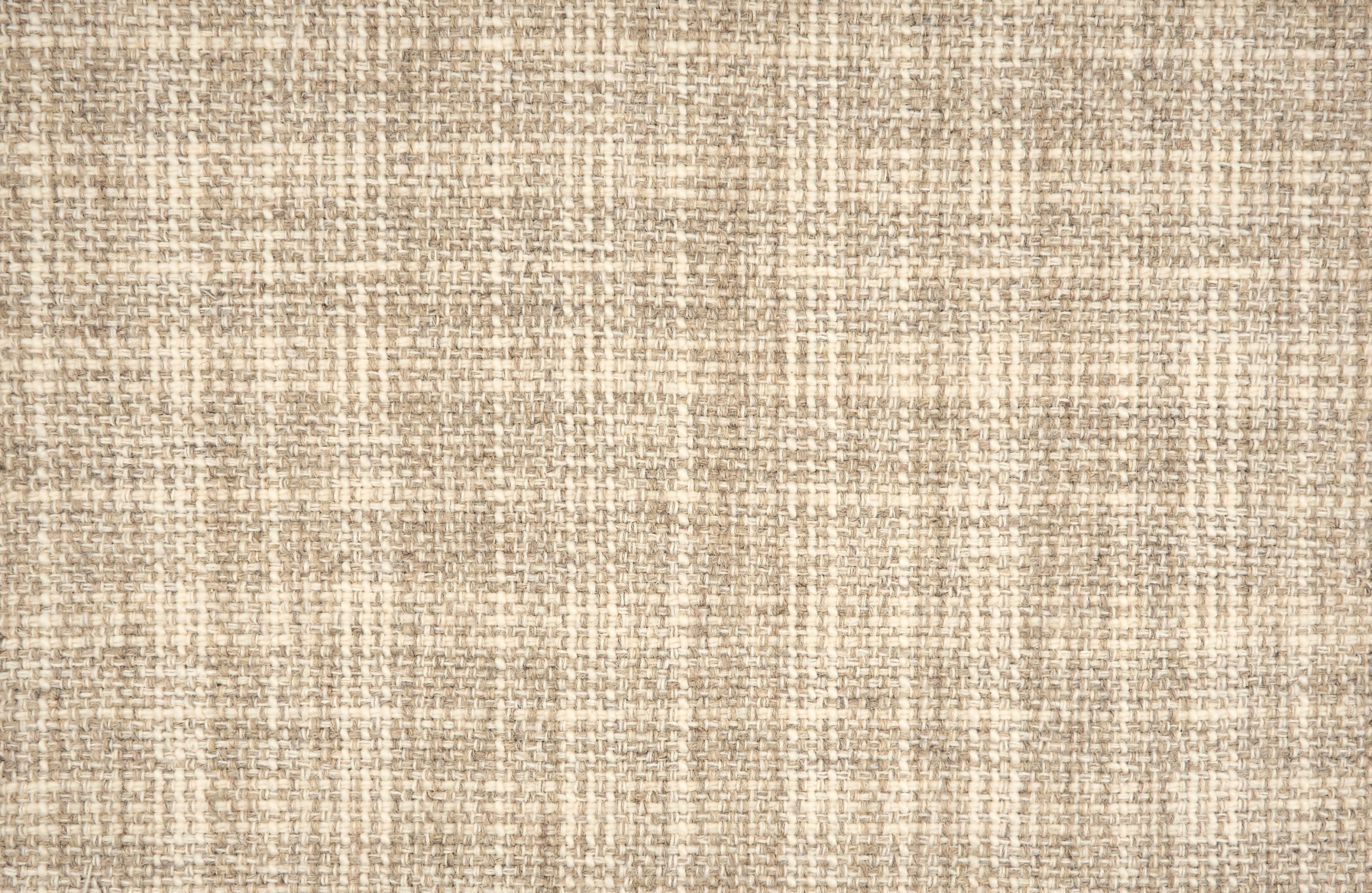 Broadloom carpet in a strié basketweave pattern in cream and beige.