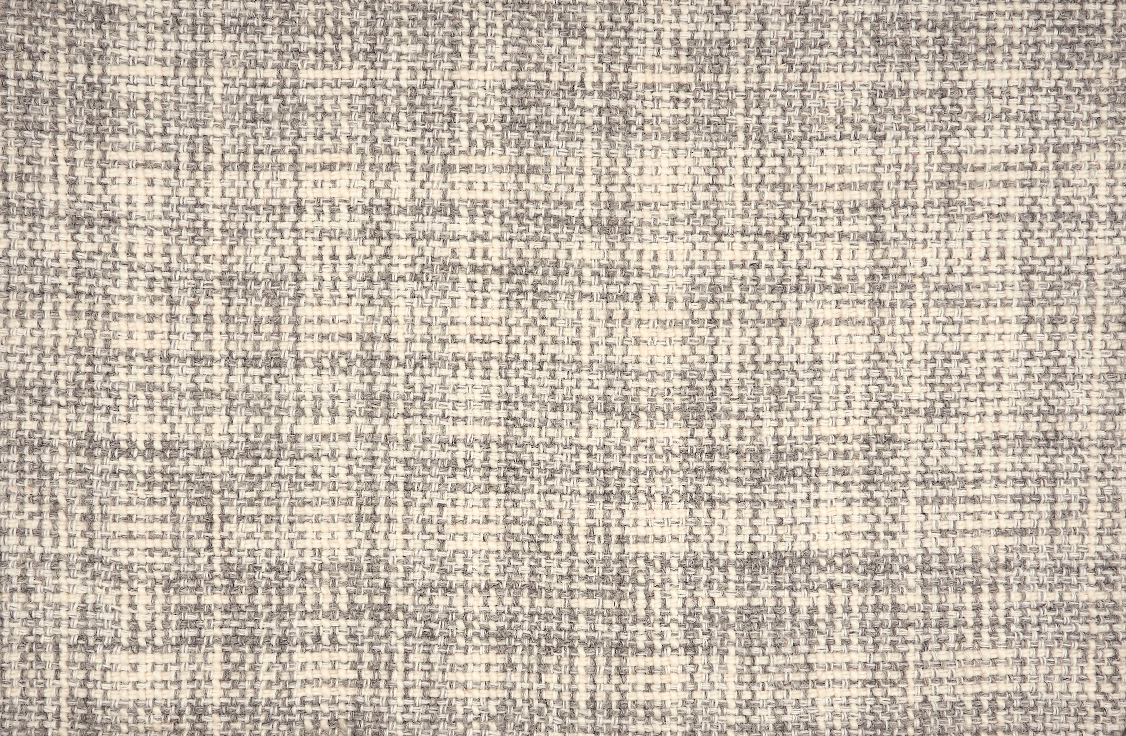 Broadloom carpet in a strié basketweave pattern in cream and grey.