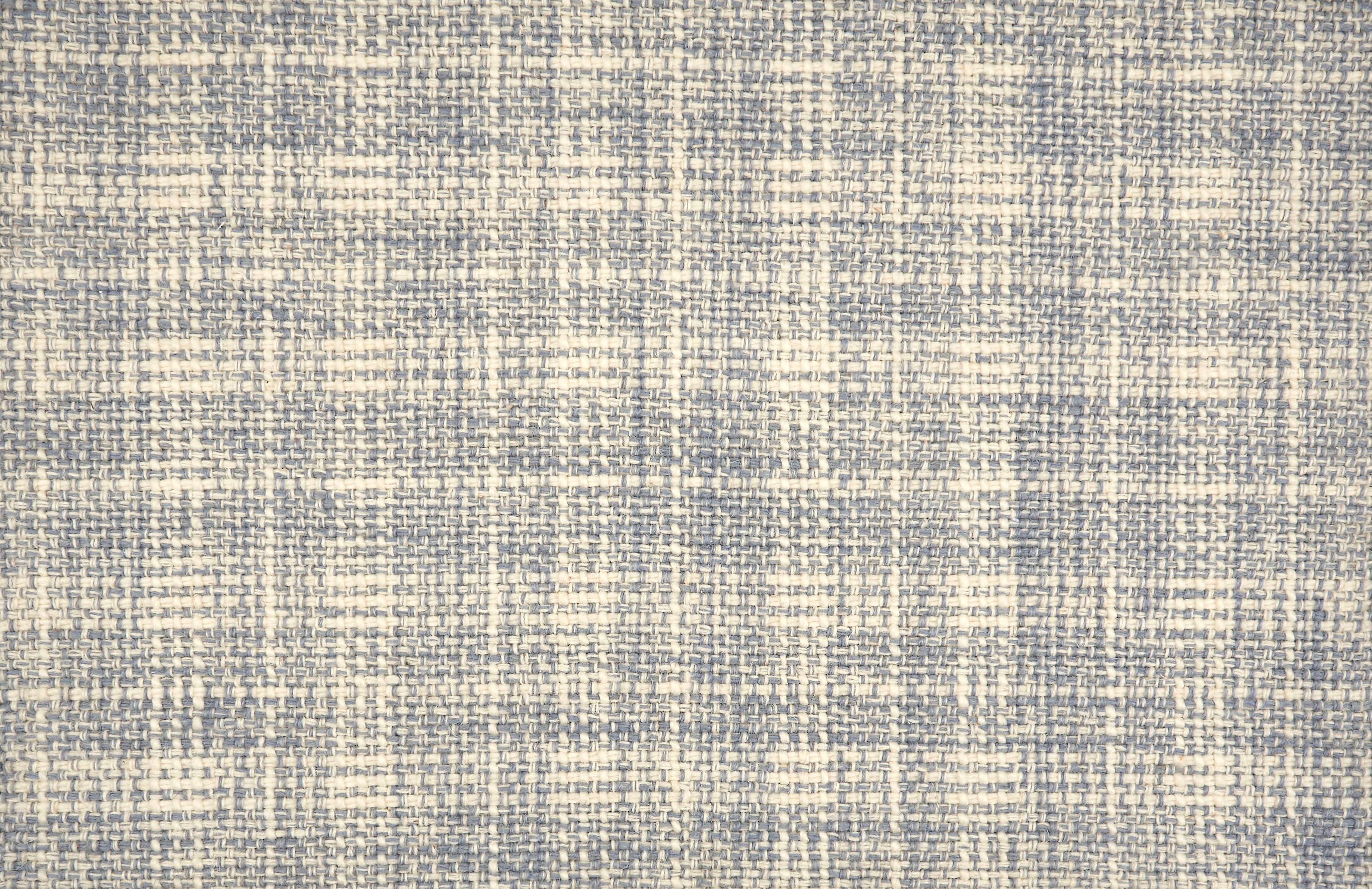 Broadloom carpet in a strié basketweave pattern in cream and blue.