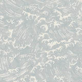 Detail of wallpaper in a playful wave print in white on a light blue watercolor field.