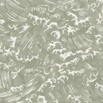 Detail of fabric in a playful wave print in white on a light green watercolor field.