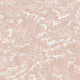 Detail of wallpaper in a playful wave print in white on a light pink watercolor field.