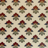 Patterned fabric with red, green, and blue floral design on a beige background