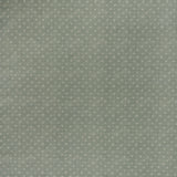 printed linen fabric in a clustered dot pattern in cream on a sage field.