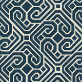 Detail of wallpaper in a geometric lattice print in navy on a cream field.