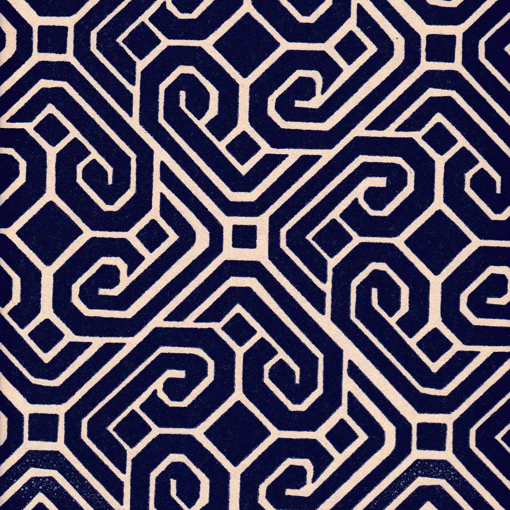 Detail of fabric in a geometric lattice print in navy on a cream field.