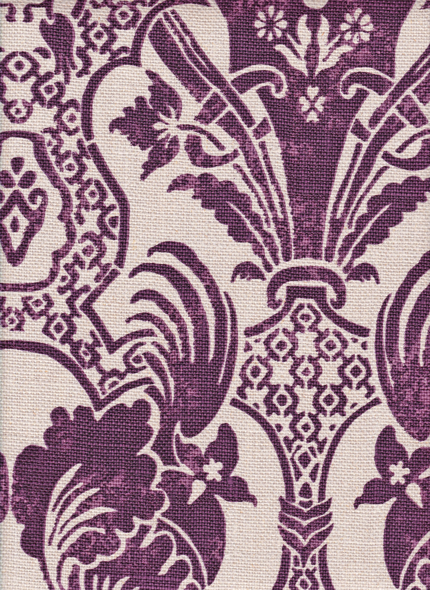 Detail of fabric in a damask vase print in purple on a cream field.