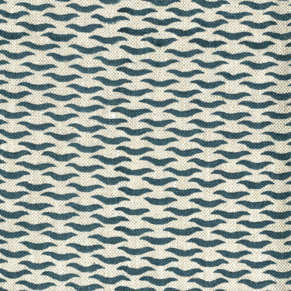 Fabric in a repeating abstract print in navy on a cream field.