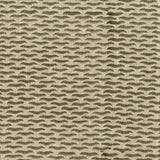 Fabric in a repeating abstract print in brown on a tan field.