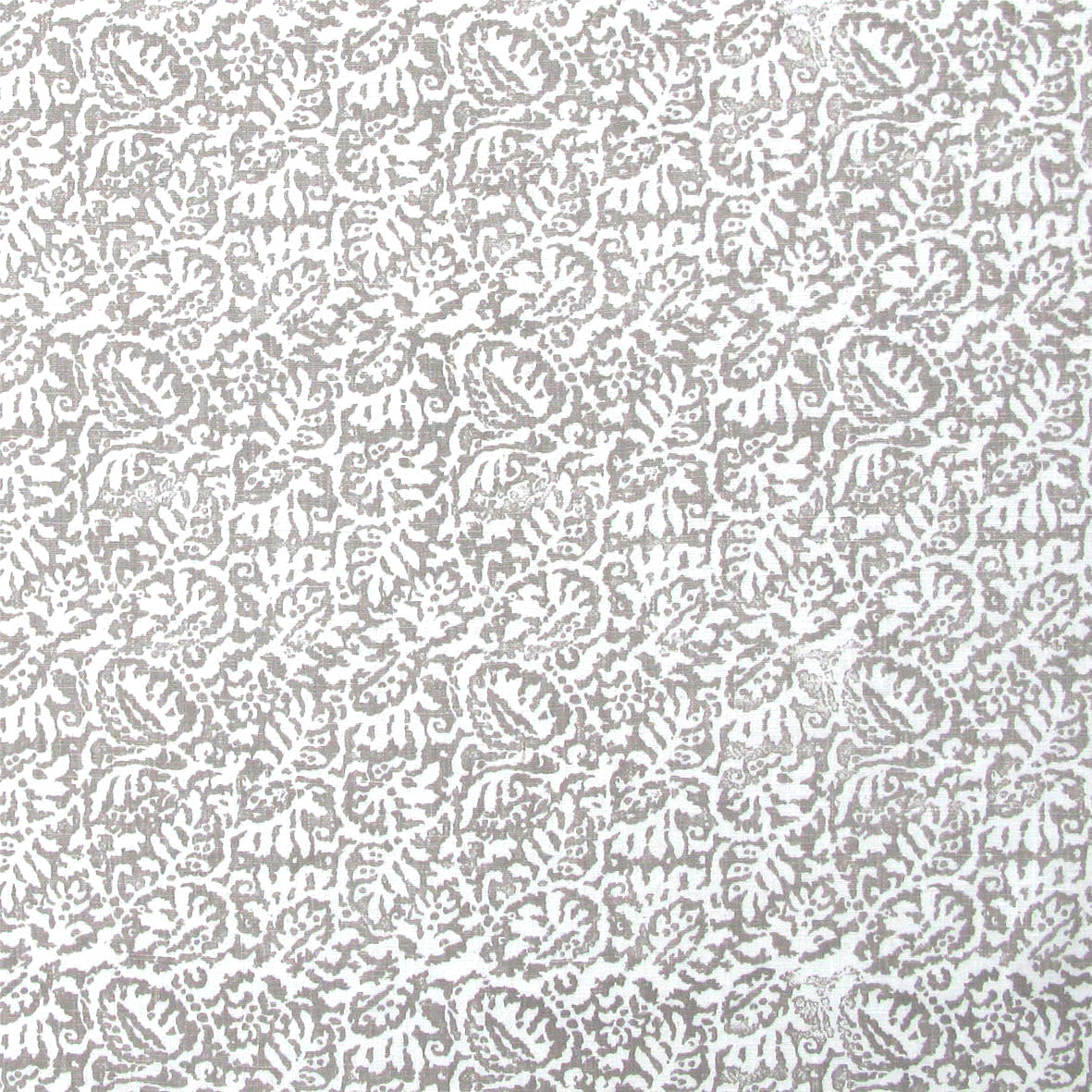 Detail of fabric in a dense paisley print in white on a mottled gray field.