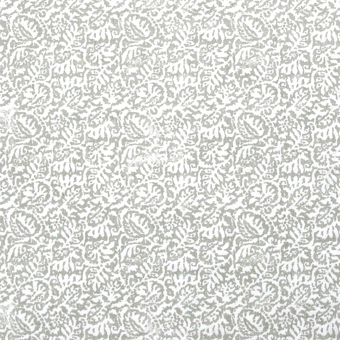 Detail of fabric in a dense paisley print in white on a light gray field.