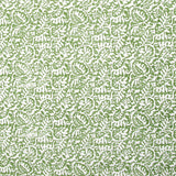 Detail of fabric in a dense paisley print in white on a green field.