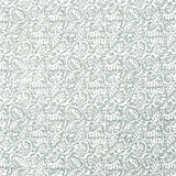 Detail of fabric in a dense paisley print in white on a gray-blue field.