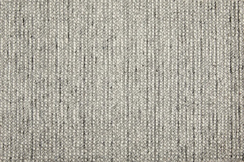 Broadloom carpet swatch in a textured pattern in a dark grey design