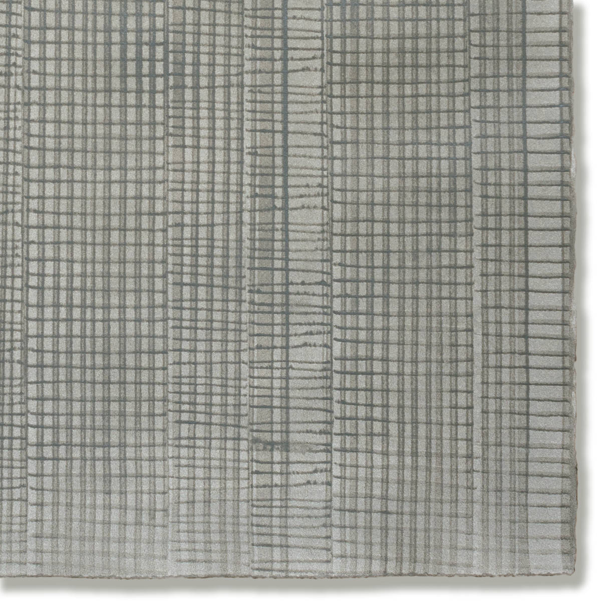Detail of a hand-painted wallpaper swatch with an irregular grid pattern in charcoal on a gray field.