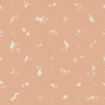 Detail of wallpaper in a playful animal and branch print in white on a coral field.