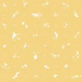 Detail of fabric in a playful animal and branch print in white on a yellow field.