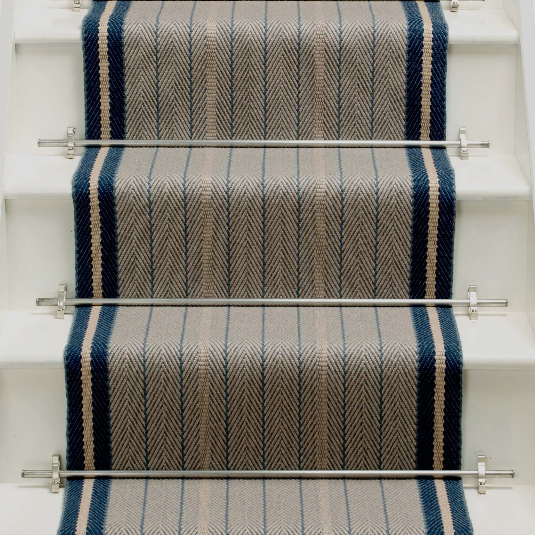 Striped flatweave runner in grey and black on white staircase