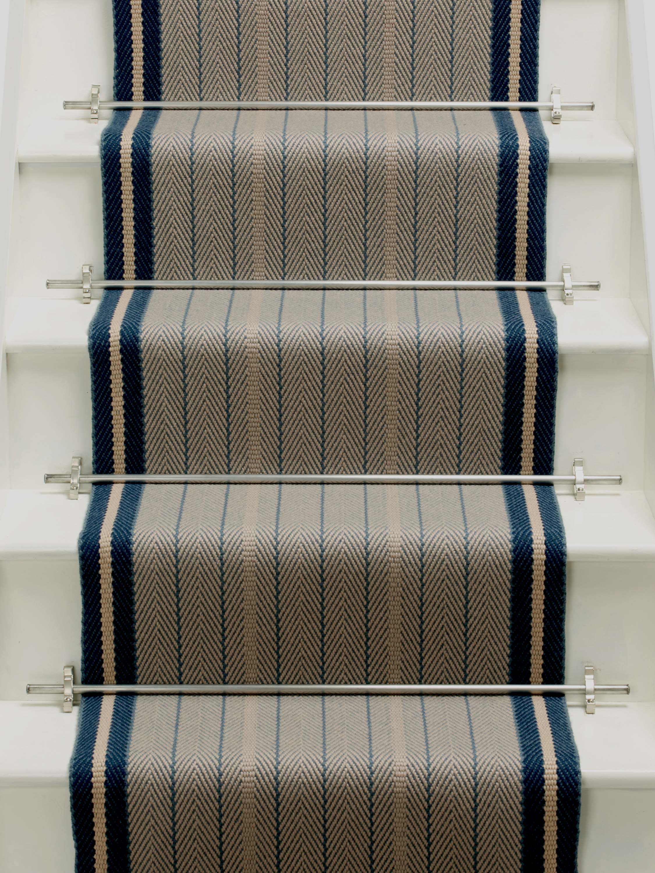 Striped flatweave runner in grey and black on white staircase