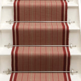 Striped flatweave runner in red on white staircase