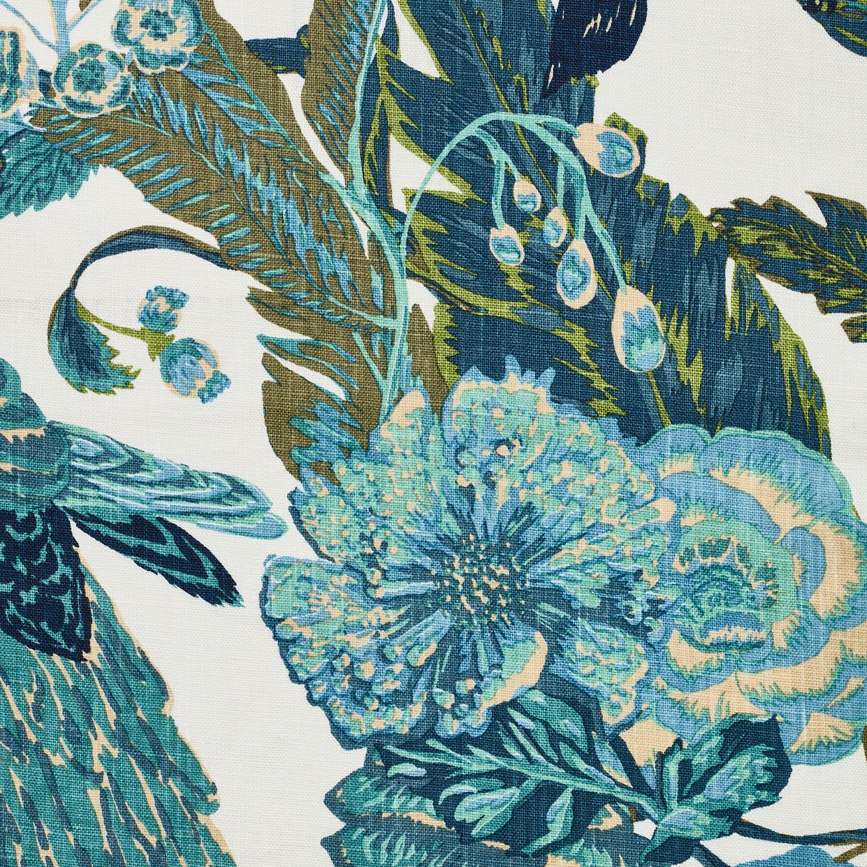 Detail of fabric in a large-scale botanical and bird print in shades of blue, green and turquoise on a white field.