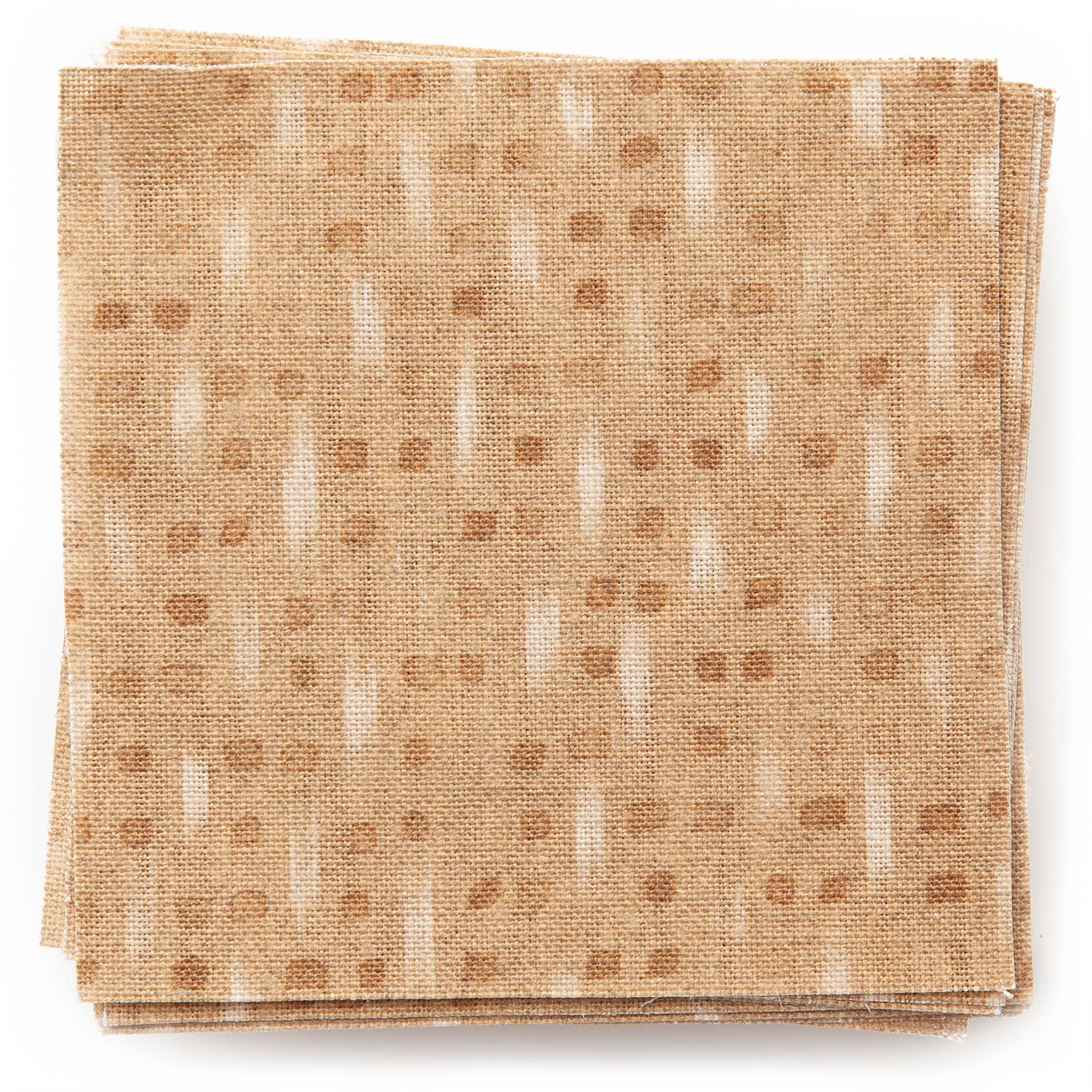 A stack of fabric swatches in a small-scale dot and dash pattern in shades of cream and brown on a bronze field.
