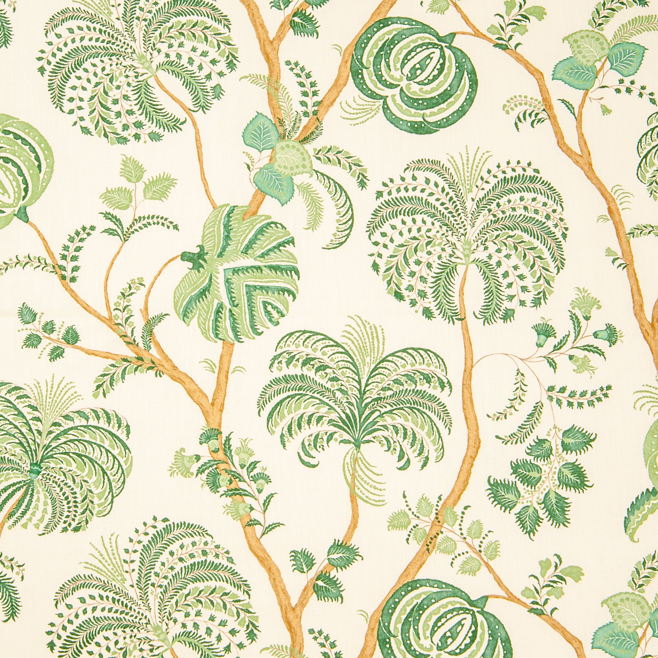 Detail of fabric in a floral paisley in shades of green and orange on a cream field.