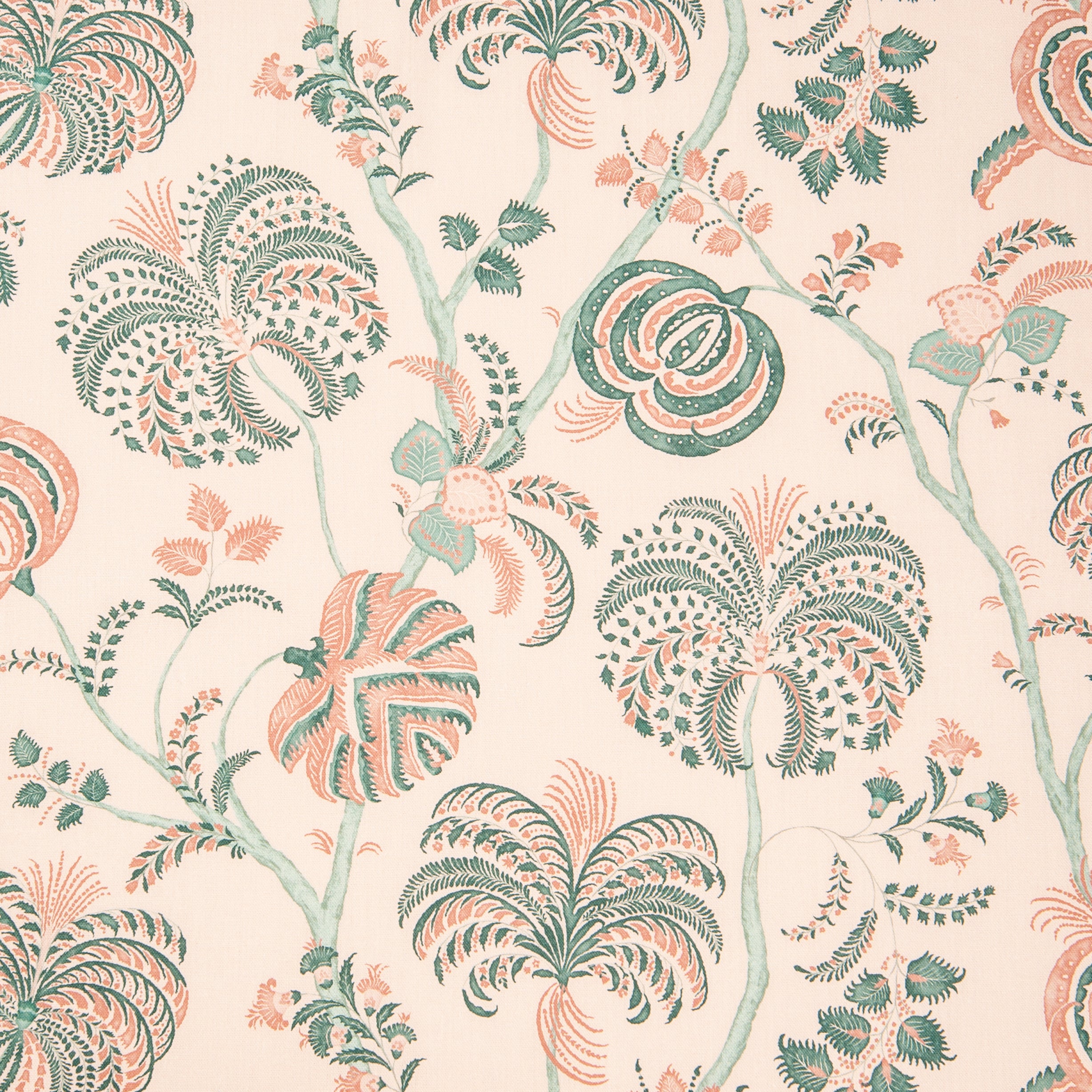 Detail of fabric in a floral paisley in shades of pink and green on a cream field.