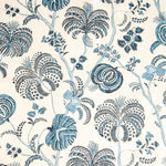 Detail of wallpaper in a floral paisley in shades of blue and navy on a cream field.