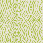 Detail of fabric in a painterly geometric grid in green on a cream field.