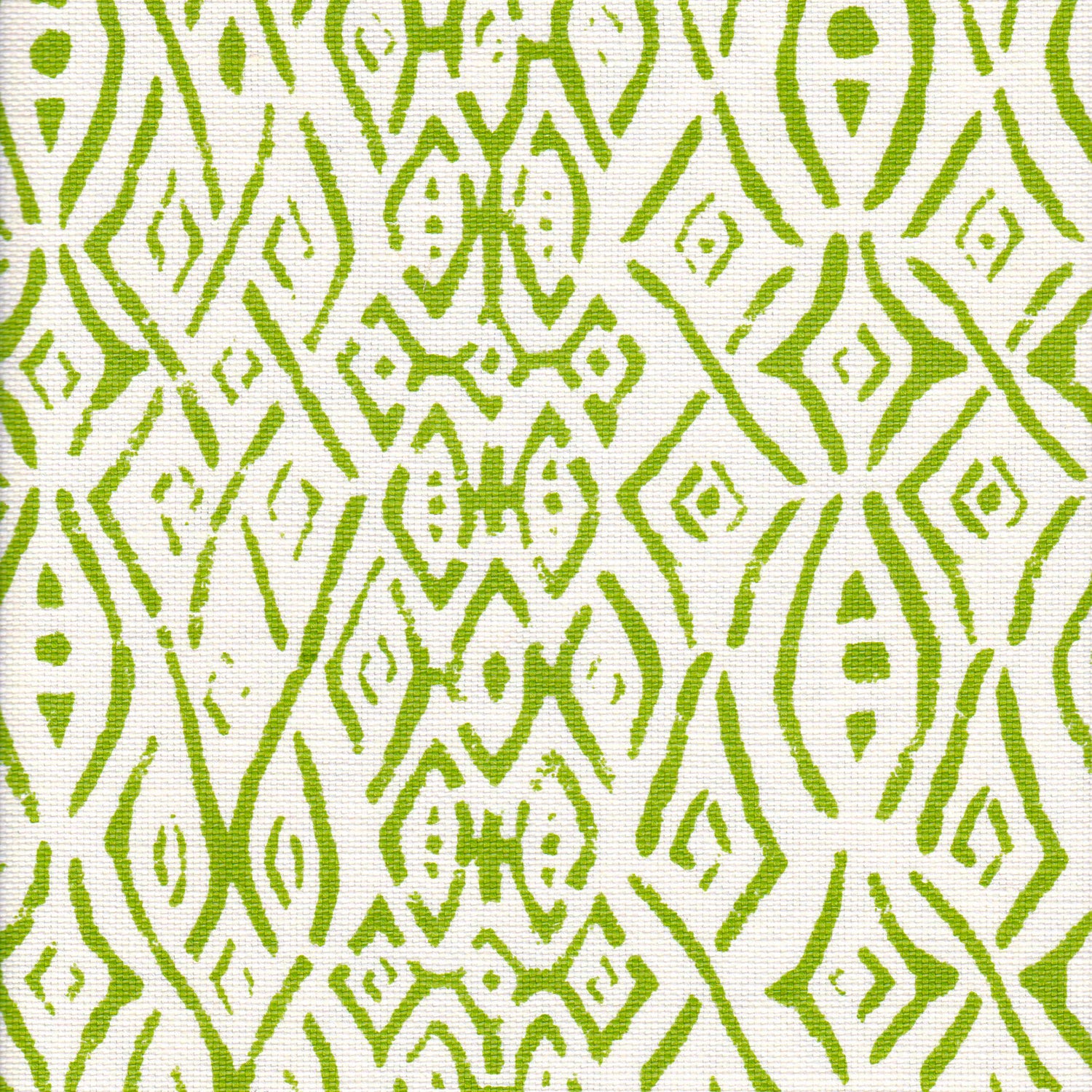 Detail of fabric in a painterly geometric grid in green on a white field.