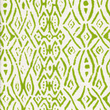 Detail of fabric in a painterly geometric grid in green on a white field.