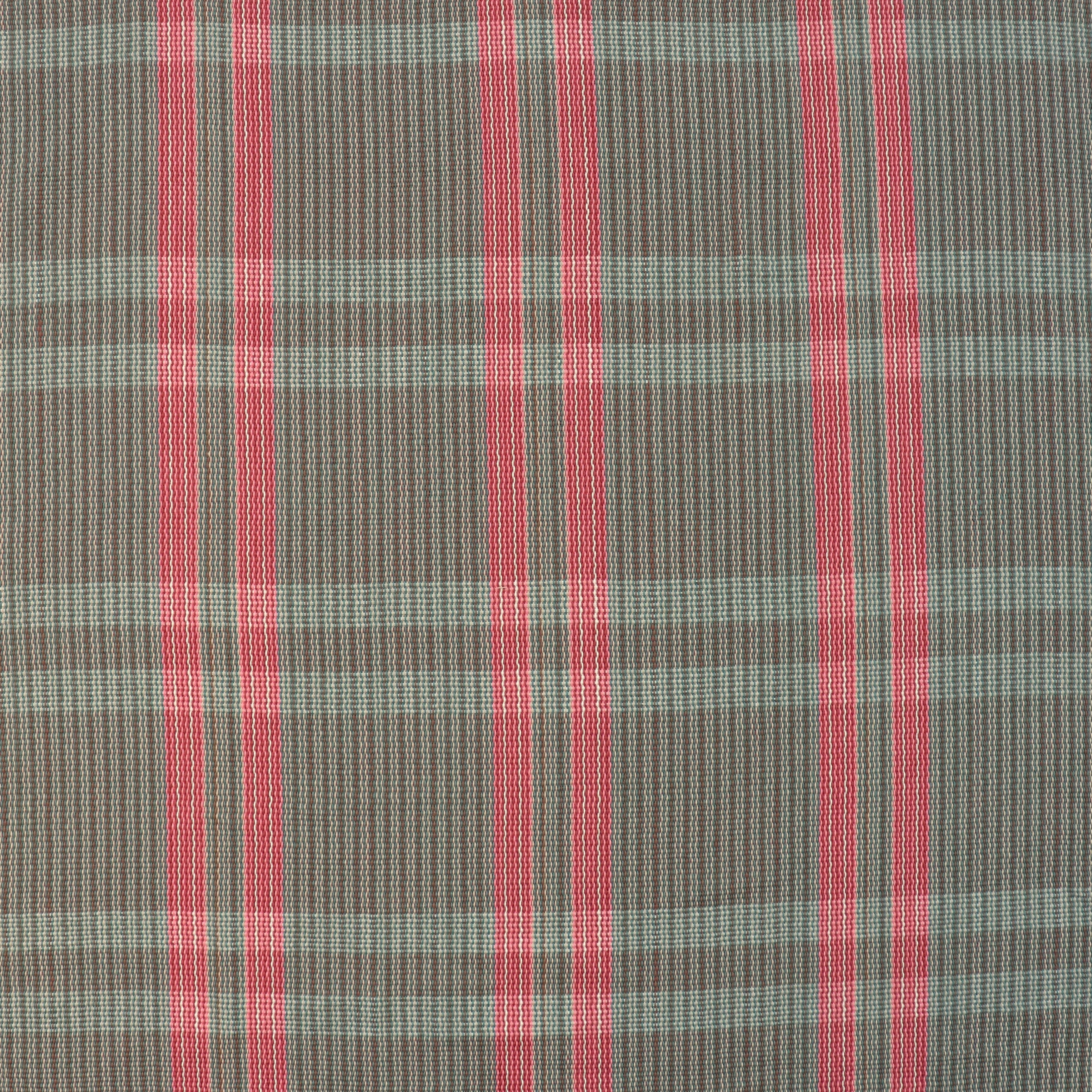 Handwoven fabric detail in a subtle window pane plaid in shades of red, pink, brown and cream. 