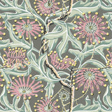 Wallpaper in a complex botanical floral design in pink, taupe, soft green and yellow. 