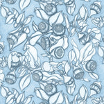 Wallpaper in a hand sketched botanical floral design in tonal shades of pale blue. 